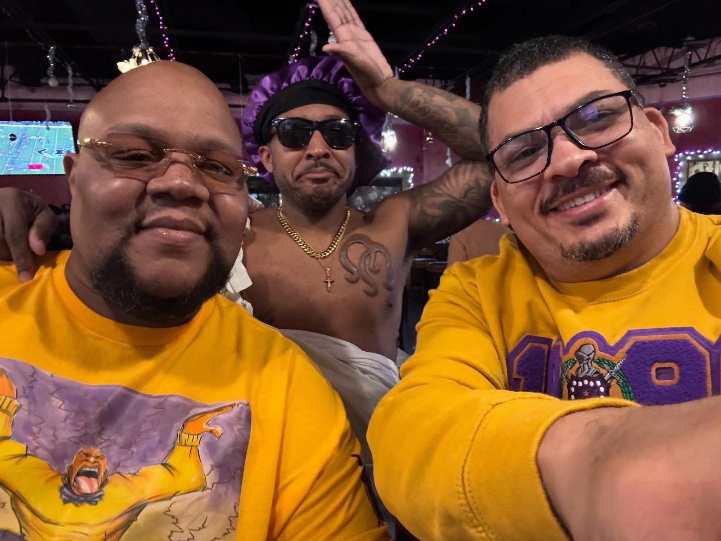Three friends taking a selfie at a party